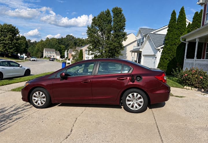 A customer's car parked in the driveway, filled overnight